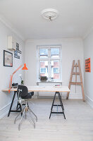 Desk on trestles in a minimalist study