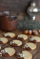 Cookies with chocolate icing and chopped hazelnuts