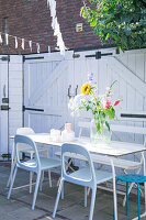 Terrace table in courtyard garden of townhouse