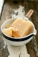 Parmesan in a ceramic bowl with a handle