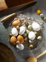 Brown and white hen's eggs with speckled quail's eggs