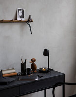 Black desk with masculine vintage accessories