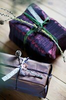 Christmas presents wrapped in paper in shades of purple