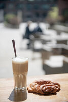 A Franzbrötchen (cinnamon pastry) and a cafe latte in Hafencity, Hamburg, Germany