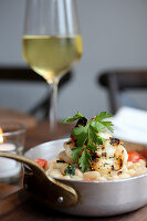 Grilled shrimp over sautéed cannellini beans