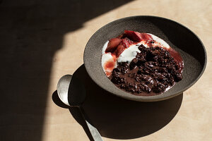 A bowl of rice with rhubarb and yoghurt
