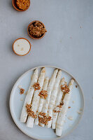 Oven-roasted asparagus with miso mayonnaise and flaxseed brittle