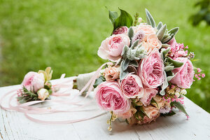 Festive bouquet with roses, lilies of the valley, Lamb's-ear, and purple bells