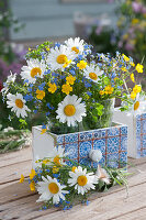 Meadow bouquets with daisies, forget-me-nots and buttercups