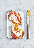 Strammer Max (sourdough bread with raw ham, fried egg, pepper and chilli flakes)