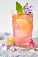 Edible flowers-Watermelon lemonade with flower ice cubes, mint and flower garnish