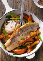 Rose fish fillet on a colourful Hokkaido pumpkin and vegetable medley in a beer teriyaki sauce
