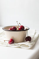 Cherries in an enamel pot