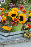 Bouquets of sunflowers, zinnias, dahlias and ornamental apples