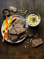 Flax seed crackers with hummus and fresh vegetables