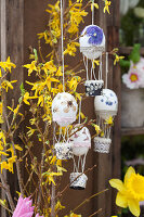 Hot-air balloons made from Easter eggs hung from forsythia branches