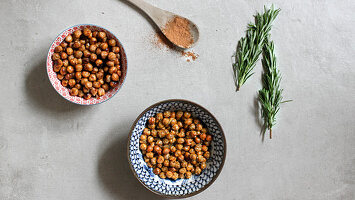 Two bowls of roasted chickpeas with sea salt and honey