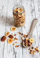 Sweet and salty granola with pecan nuts and dried bananas