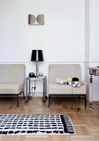 Two easy chairs in classic living room with parquet floor