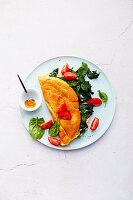 omelet filled with spinach and tomatoes