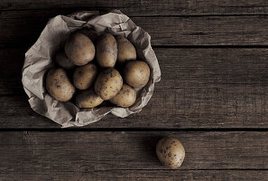 Organic potatoes on a wooden table