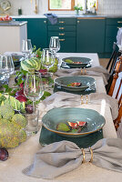 Set table with a center piece of vegetables for harvest festival