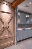 Blue-grey cupboards and washbasin in a guest toilet