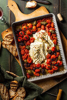 Baked feta with tomatoes, olives and rosemary