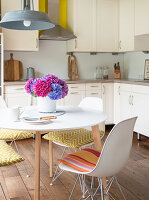 Round table with modern chairs in the kitchen