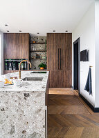 Stone kitchen island and cabinets with wooden fronts