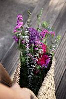 Early summer bouquet of peonies, ornamental leek, beach lilac, maiden in the green and eucalyptus