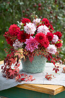 Autumn dahlia bouquet with rose hips and wild vine tendrils