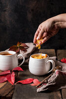 Spicy tomato soup with vegetables and cheddar