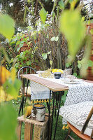 Garden table with birch bark decorations and wooden box