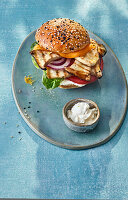 Vegetarian cheeseburger with grilled herb mushrooms