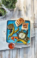 Grilled goat's cheese in a vine leaf with an ajvar dip