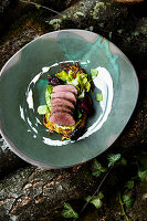 Saddle of venison with blackberries, lime leaves and potato rösti