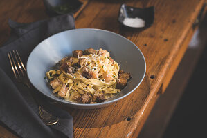 Tagliatelle Carbonara with Pork cheek, cream sauce, grating of parmesan cheese