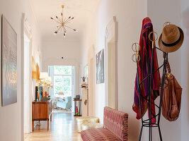 Elegant designed hallway with vintage furniture and modern art