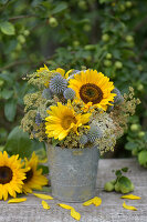 Late summer bouquet with sunflowers and globe thistles