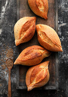 Hand-shaped rolls with caraway seeds