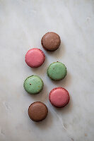 Assorted macaroons on a grey background