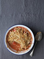 Rhubarb crumble on a grey tablecloth