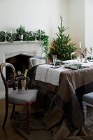 Ice cooler on chair in dining room with Christmas tree and decorations