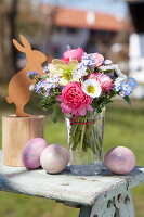 Colorful spring bouquet of bellis, ranunculus and forget-me-nots