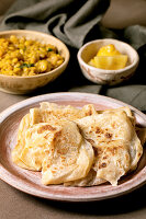 Traditional indian roti flatbread with yellow pea dhal