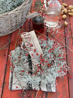 Wreath of hawthorn and calecephalus with wooden sign