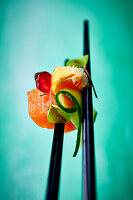 Marinated char, marinated cucumber, and baked egg yolk (Close up)