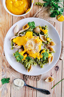 Pasta with creamy butternut squash sauce on pasta