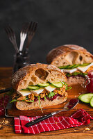 Sandwiches with pulled turkey, cranberry jam, and camembert cheese